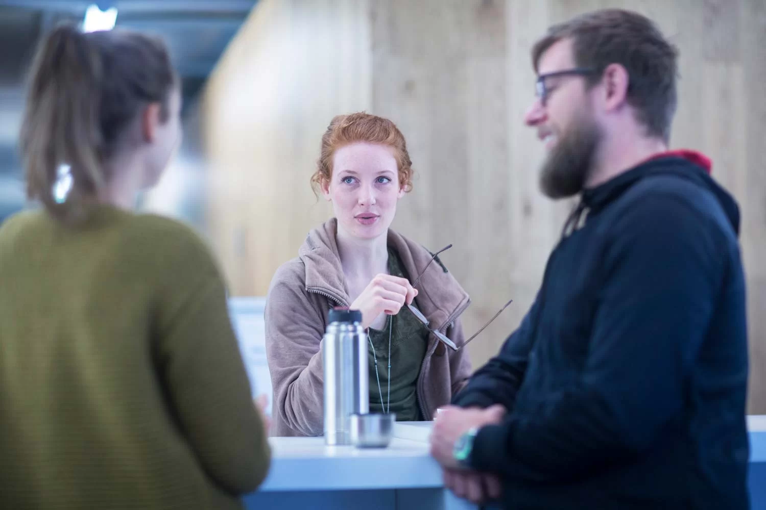 Students at university discussing their dissertation